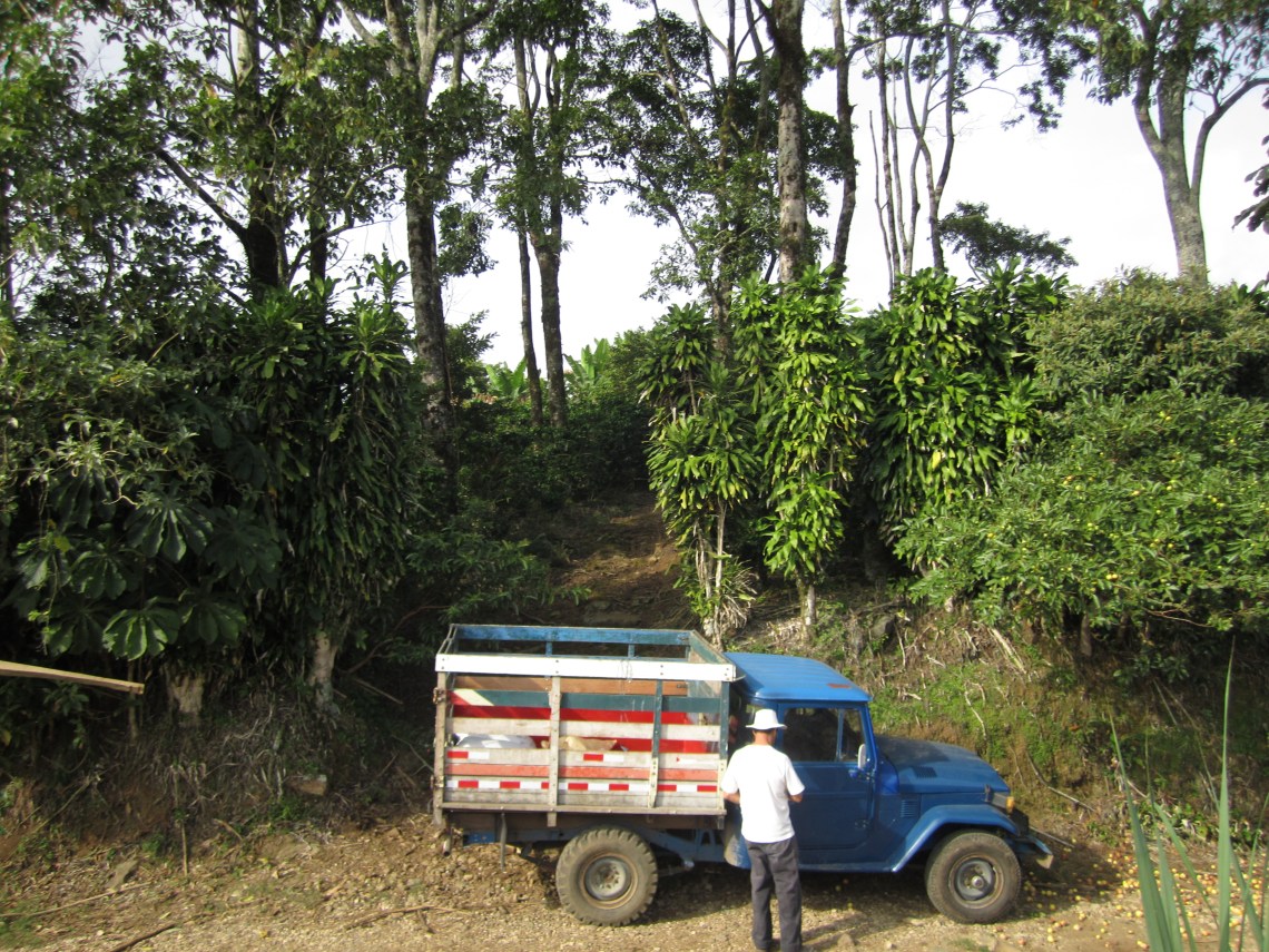 Roberto and his truck, Chola, at the entrance to his property