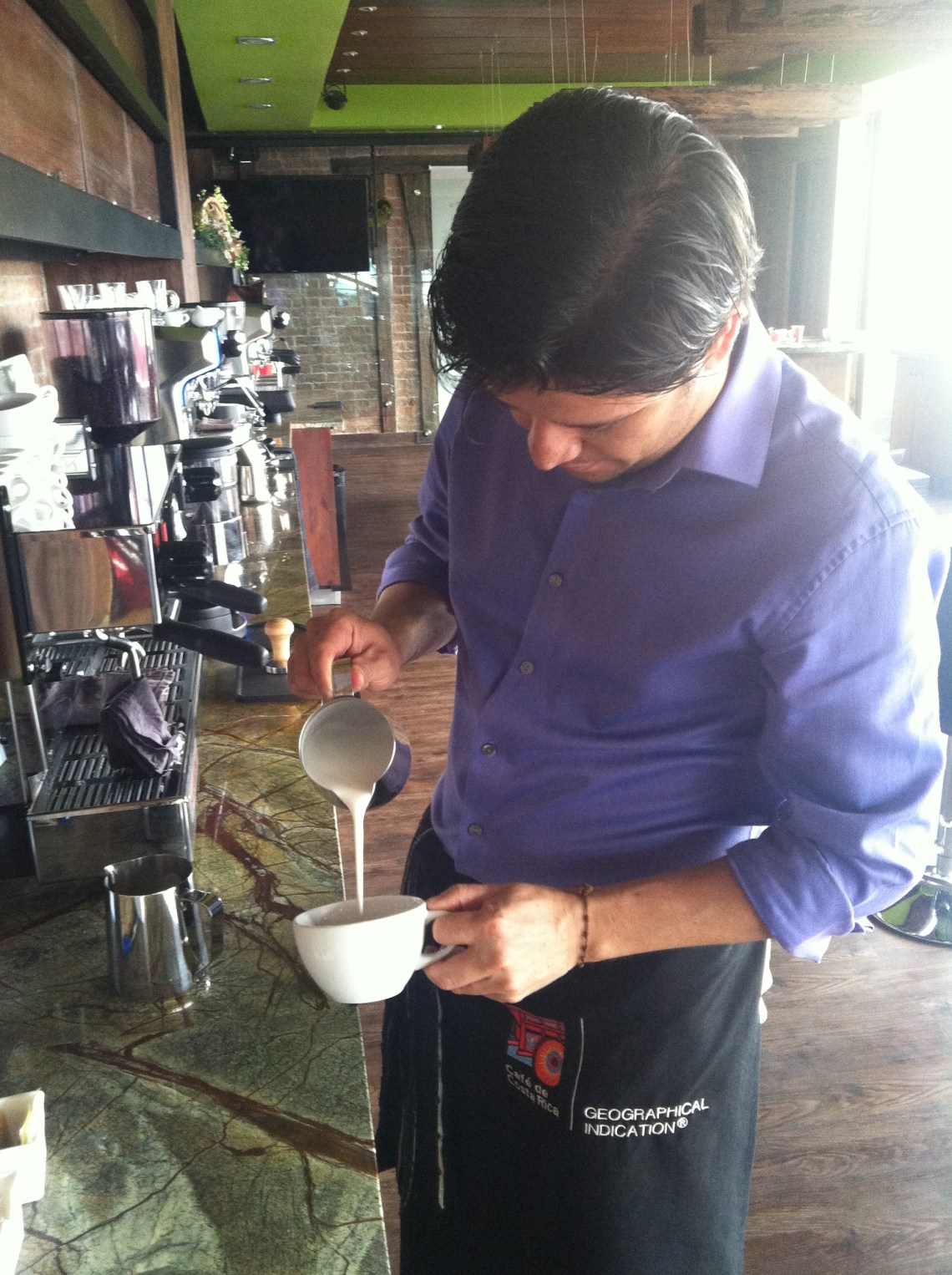 And performing the delicate hand pour required for latte art