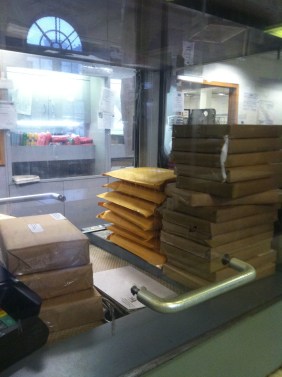 Into the world! Pound by pound. The post office exists to remind you precisely how much things weigh.